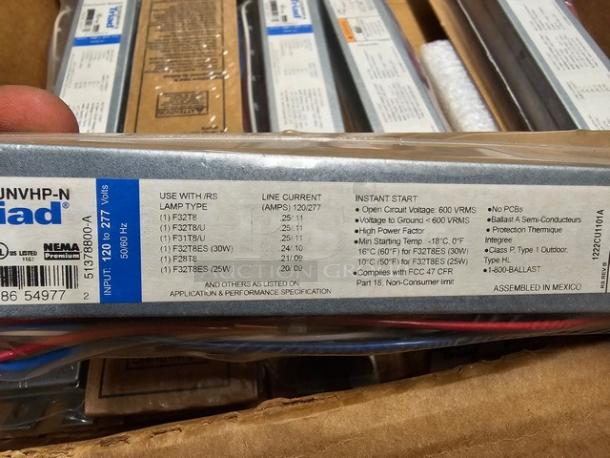 Two boxes of Universal Triad B232IUNVHP-N electronic ballasts, new, model info visible, suitable for various F32T8 lamps.