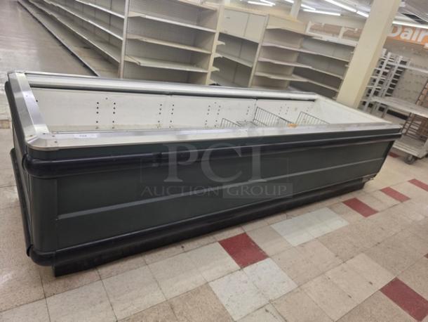 12' Hussmann LI-12U island case, gray exterior, metal trim, used condition, open refrigeration display unit.