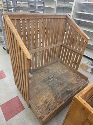 Wooden display bin with vertical slat design, worn surface, suitable for retail use, medium size, sturdy construction.