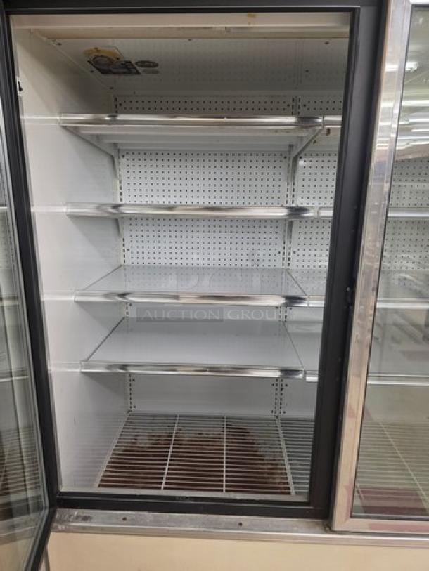 Lot of two Kysor/Warren freezer display cases model #LV5HF1-3U, featuring six glass doors and multiple shelves; no compressor included.