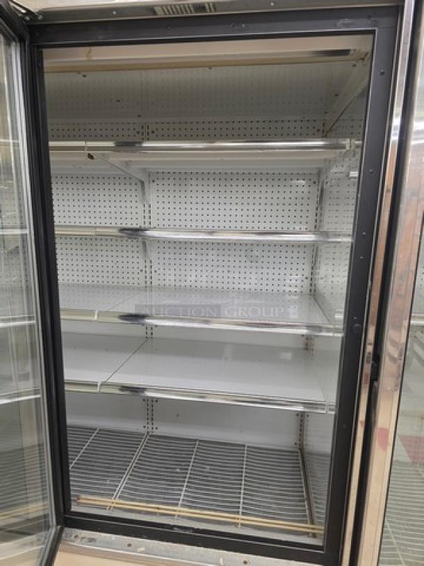 Kysor/Warren freezer display case, model LV5HF1-3U, six-door configuration, no compressor, shelves visible, sold by door.