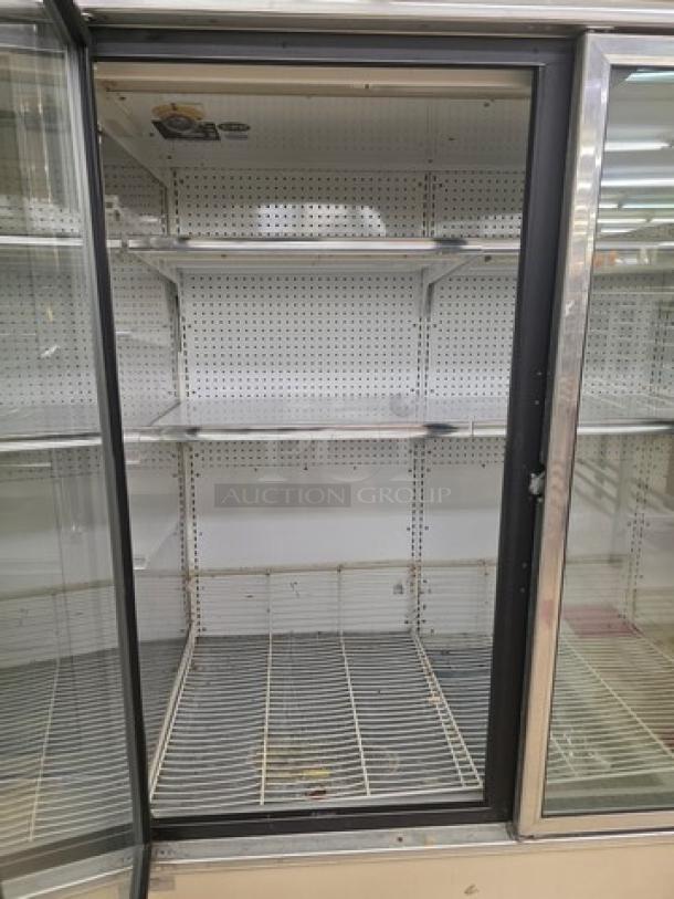 Lot of two Kysor/Warren freezer display cases, model LV5HF1-3U, no compressor, six doors, interior shelves, good condition.