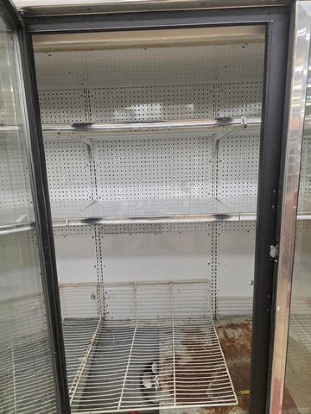 Lot of two Kysor/Warren freezer display cases, model #LV5HF1-3U, six doors, no compressor, shelves intact, sold by door.
