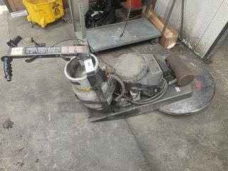 Propane-powered floor buffer in used condition, featuring a propane tank and control panel. Scratched surface. Model details unclear.