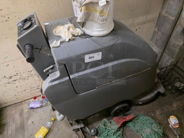 Tennant Floor Scrubber, used condition, gray exterior, model tag labeled "366," with operational controls visible on handle.