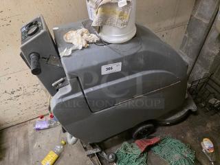 Tennant Floor Scrubber, used condition, gray exterior, model tag labeled "366," with operational controls visible on handle.