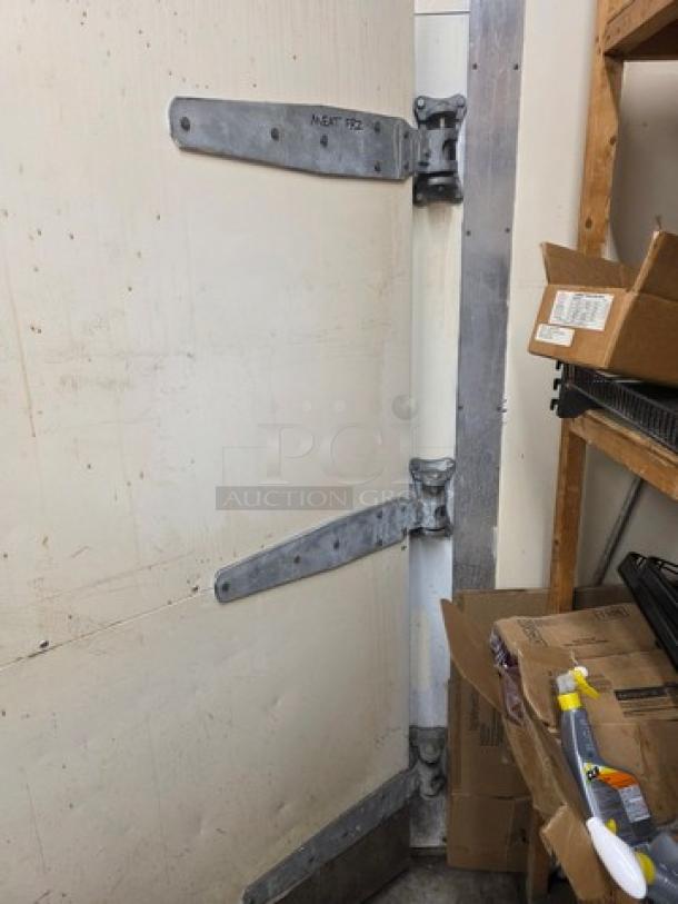 Walk-in door with metal hinges and hardware attached. Light wear, includes mounting fixtures. Suitable for commercial use.