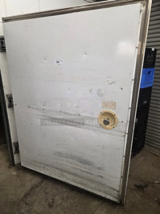 White walk-in door with hardware, used condition, visible scratches and dents. Includes handle, number label "386" attached.