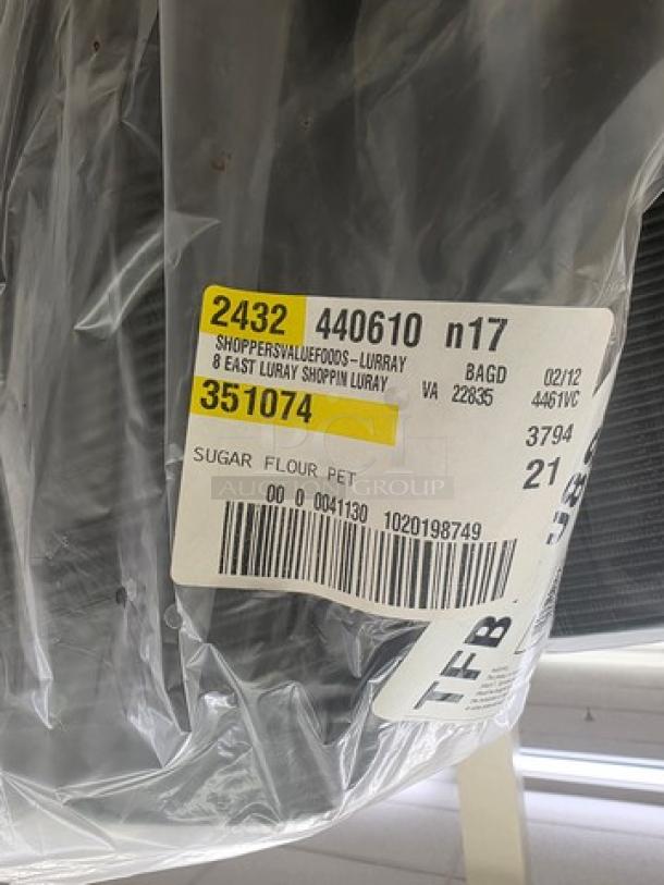 Plastic-wrapped disposable food trays with label: "Shoppers Value Foods, Luray, VA 22835," item code "2432 440610."