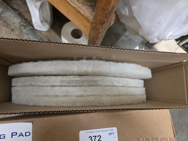 Lot of two 24" white buffering pads in box, new condition, marked "2XBID," item tag "372."