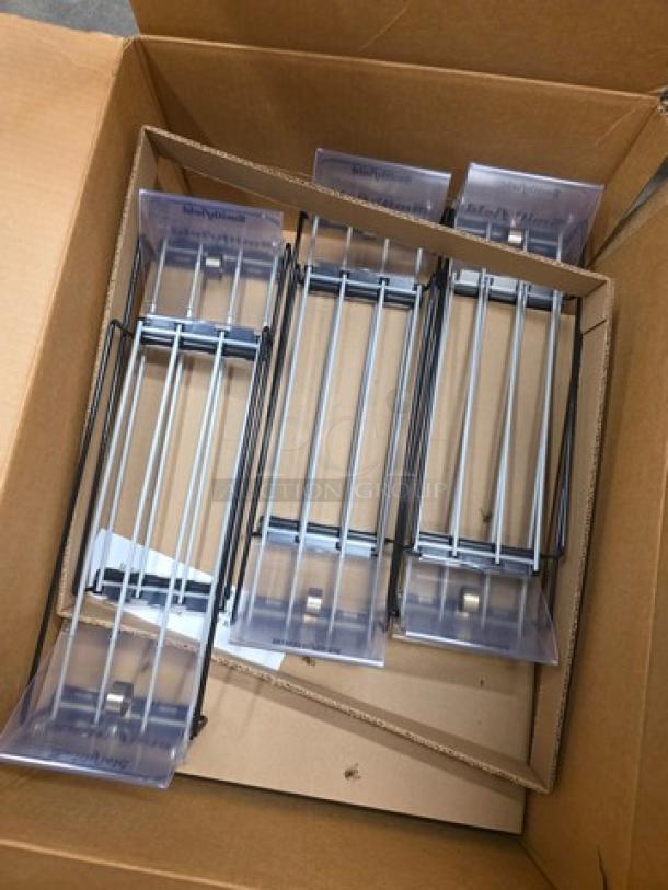 Box of wire spring-loaded shelf pushers in new condition, with clear plastic fronts, ideal for retail display organization.