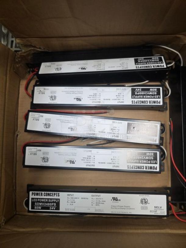 Box of Power Concepts LED power supplies, model SDW-2448P-24V, new condition, visible certification markings.