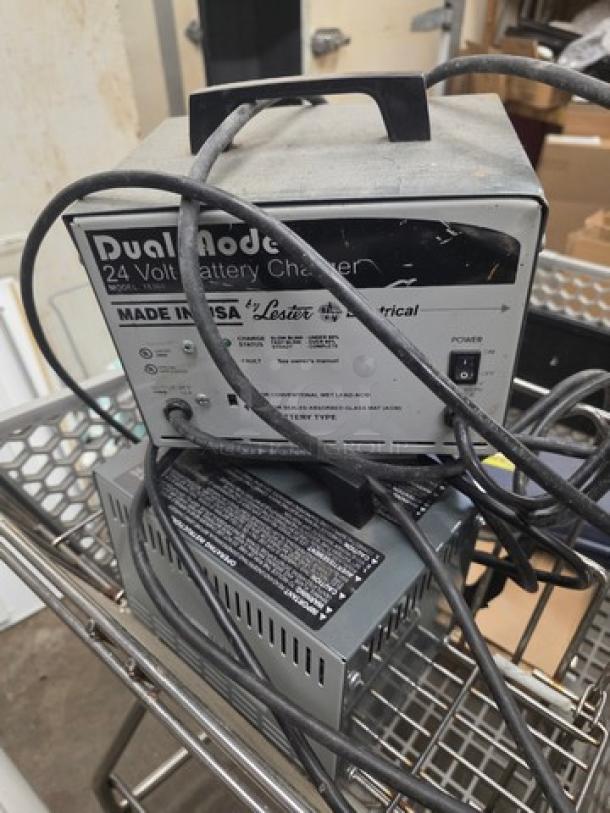 Lot of two 24V battery chargers, model 18360, labeled "Dual Mode" and "Made in USA" by Lester Electrical. Good used condition.