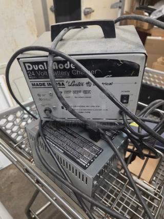 Lot of two 24V battery chargers, model 18360, labeled "Dual Mode" and "Made in USA" by Lester Electrical. Good used condition.