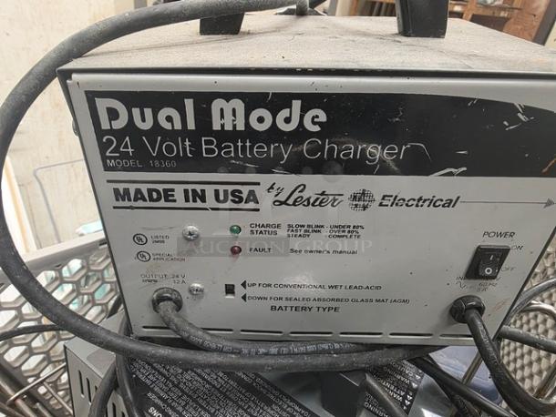 Lot of two Dual Mode 24 Volt Battery Chargers, Model 18360, by Lester Electrical. Used, with visible wear. Made in USA.