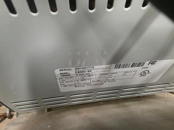 Lot of two Model 18360 24 Volt Battery Chargers, special application use, visible label details specs and serial number.