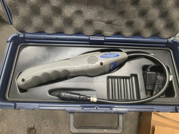 Yellow Jacket Accuprobe refrigerant leak detector with heated sensor in a protective case. Includes power adapter. Mint condition.