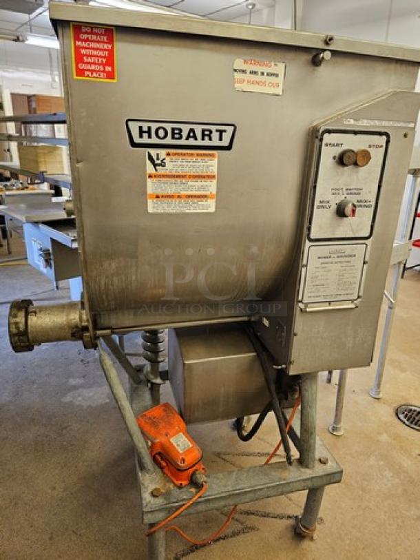 Hobart Meat Grinder & Mixer, industrial model, metal casing, operational controls, warning labels, and visible power cord.