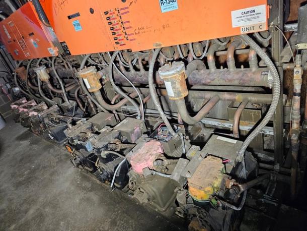 Commercial refrigeration compressor rack, medium temp, 134A, 40 HP. Features multiple units, visible wear, labeled Unit C.