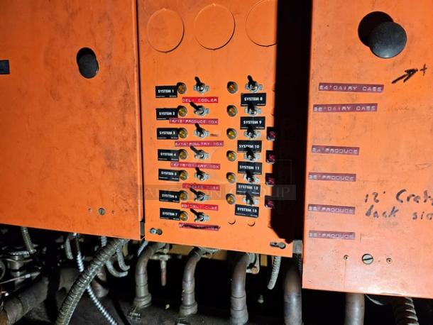 Commercial refrigeration compressor rack, medium temp, 134A, 40 HP. Control panel with labeled switches for system operations.