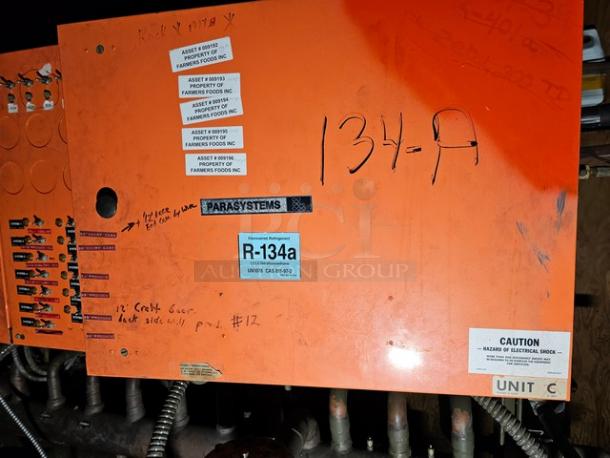 Commercial refrigeration compressor rack, medium temp, 134A, 40 HP. Displayed asset tags, caution labels, and handwritten notes.