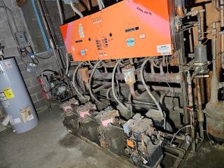 Commercial refrigeration compressor rack, medium temp, R134A, 40 HP, used condition, visible wear and labels.