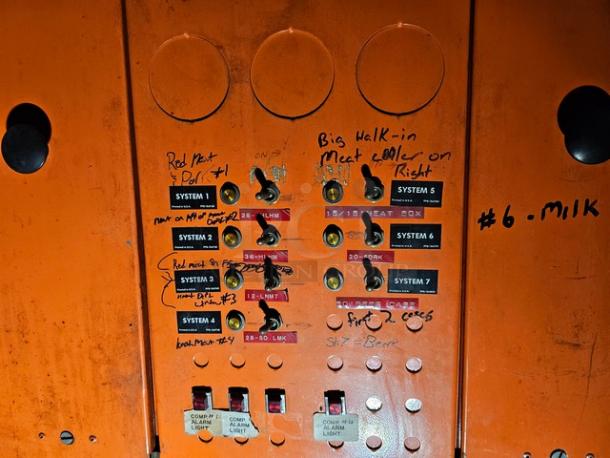 Commercial refrigeration compressor rack, medium temp, 134A, 40 HP. Handwritten labels for system and meat cooling management.