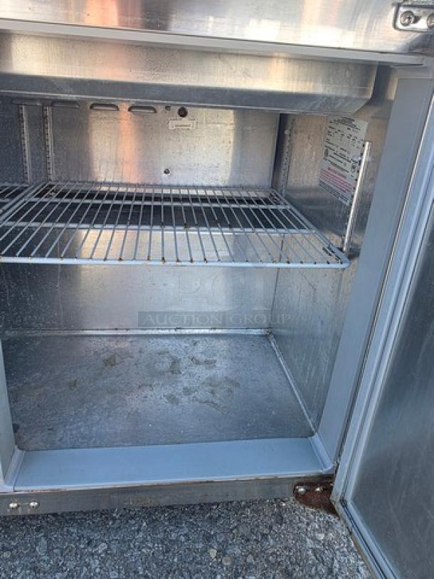 Continental SW72-30M 72" commercial sandwich prep unit interior, showing wire shelf and stainless steel finish.