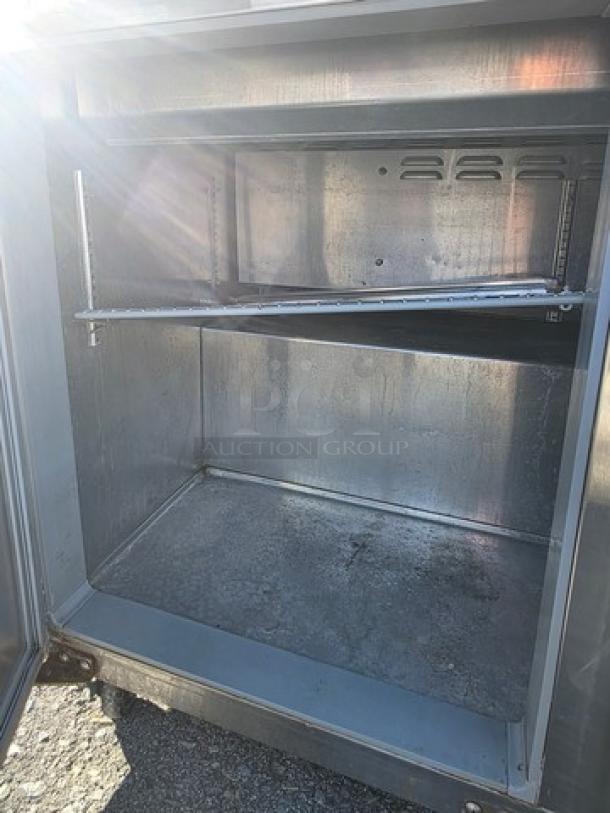 Continental SW72-30M 72" commercial sandwich prep unit, stainless steel interior, used condition, open storage view.