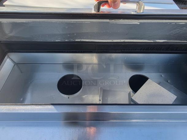 True 2 Door Pizza Prep Table TPP-67 with stainless steel interior, dual compartments, and sturdy handle. Good condition.