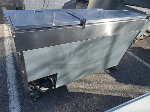True 2 Door Pizza Prep Table TPP-67, stainless steel, dual-hinged lids, commercial use, on wheels, good condition.