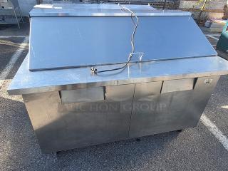 True QA-60-24M-B 60" refrigerated prep table, stainless steel, dual compartments, visible wear, electrical cord attached.
