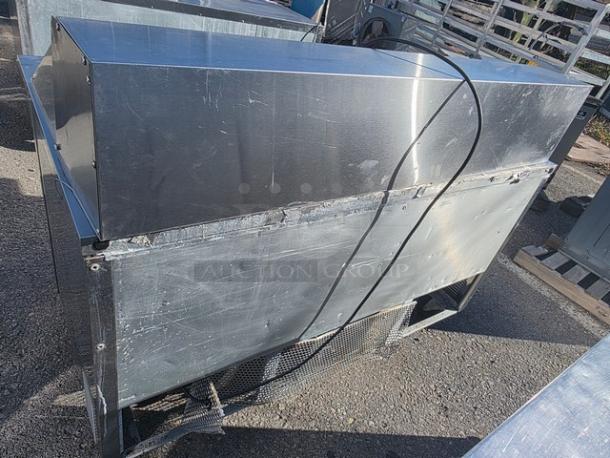 True QA-60-24M-B 60" refrigerated prep table, stainless steel, exterior wear visible, suitable for commercial kitchens.