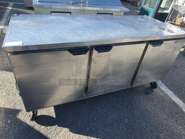 Beverage Air WTR72AY 72" stainless steel worktop refrigerator, three doors, visibly worn condition, kitchen appliance.