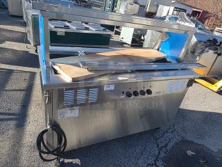 Delfield SH-4-NU 60" Shelleysteel electric hot food serving counter, stainless steel, knobs and power cord visible, fair condition.