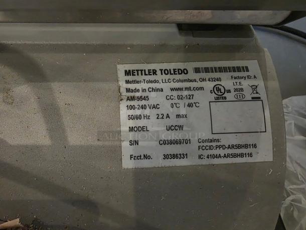 Mettler Toledo UCCW Smart Touch Counter Scale label showing specifications, model UCCW, serial number C038069701.