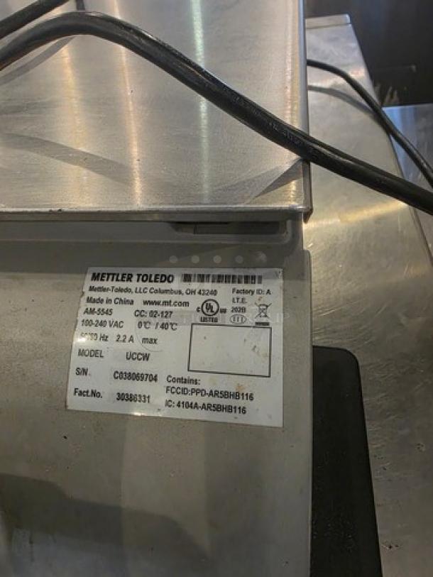 Mettler Toledo UCCW Smart Touch counter scale for deli/bakery use, shown with model/serial number label, in good condition.