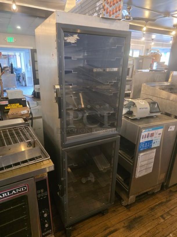 Metro DD8119 Transport Cabinet, stainless steel, multiple trays, dual glass doors, used condition, ideal for food service.
