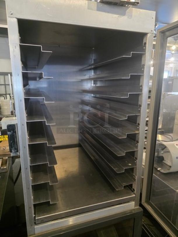 Metro DD8119 transport cabinet with multiple shelves, stainless steel interior, used condition, ideal for food service storage.
