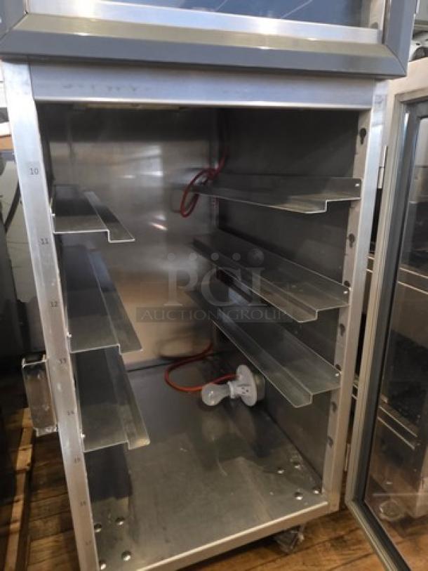 Metro DD8119 Transport Cabinet, stainless steel, multiple shelves, excellent condition, interior power socket, model DD8119.
