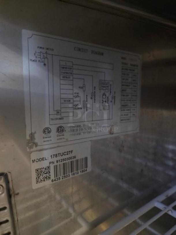 Avantco 178TUC27F undercounter freezer, 28" wide, stainless steel, model label visible, circuit diagram included, good condition.