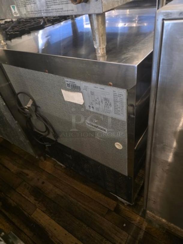 Avantco 178TUC27F 28" wide undercounter freezer with visible labels, showing good condition and stainless steel exterior.