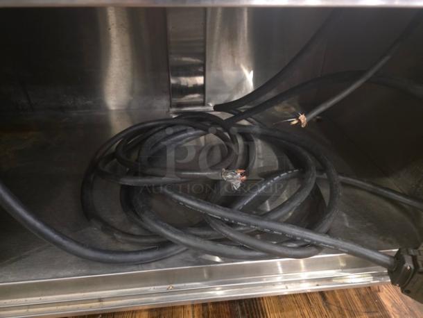 Custom 5 well steam table with visible wiring, stainless steel construction, in used condition, suitable for commercial kitchens.