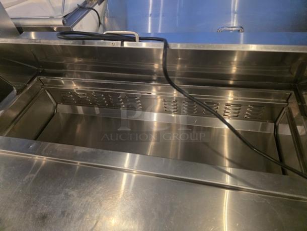 Avantco 178APT48HC 47" 2 Door Refrigerated Sandwich Prep Table in stainless steel, excellent condition, spacious interior.