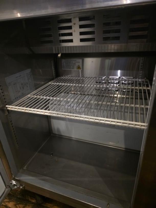 Avantco 178APT48HC 47" 2 Door Refrigerated Sandwich Prep Table, stainless steel, internal shelving visible, good condition.