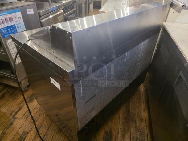Avantco 178APT48HC 47" 2 Door Refrigerated Sandwich Prep Table in stainless steel. Slight wear visible. Model label shown.