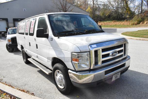 2012 Ford E-350 Van, white, with 4 removable seats, odometer at 96,764 miles, VIN 1FBSS3BL3CDA01043, displays side decals.