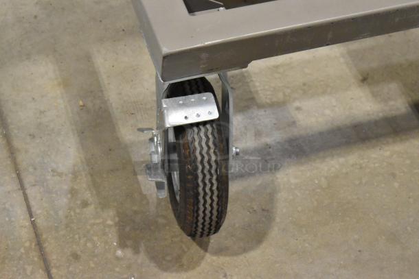 Kyocera solar panel installation on wheeled Hampden controller platform, showing one caster wheel for mobility.