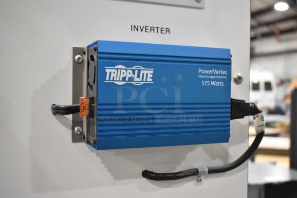 Kyocera solar panel system on Hampden controller, featuring Tripp Lite PowerVerter 375W inverter, installed on a white panel.