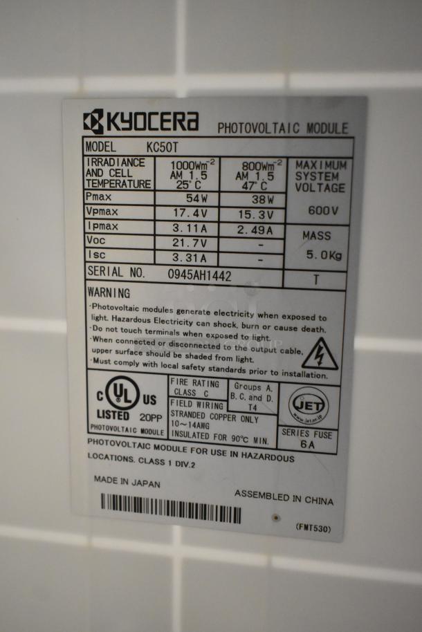 Kyocera solar panel model KC50T label, 54W max, 600V, 5Kg, made in Japan, assembled in China, serial 0945AH1442.
